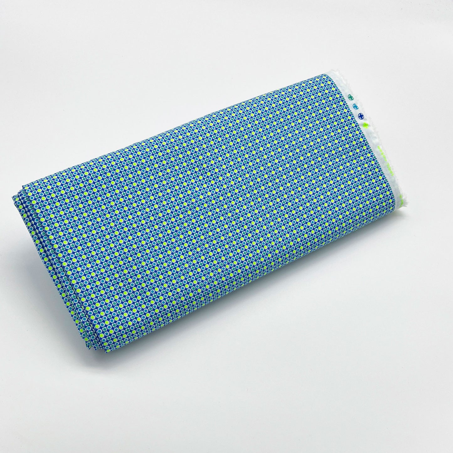 Tessuto fantasia geometrica con pois giallo fluo