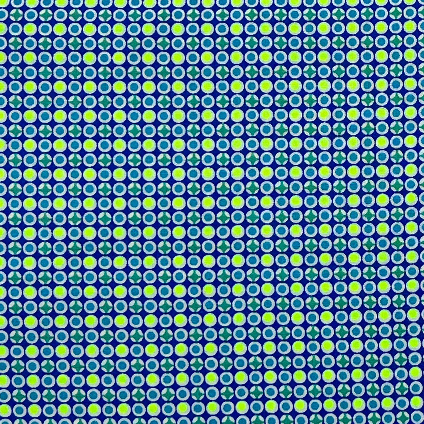 Tessuto fantasia geometrica con pois giallo fluo