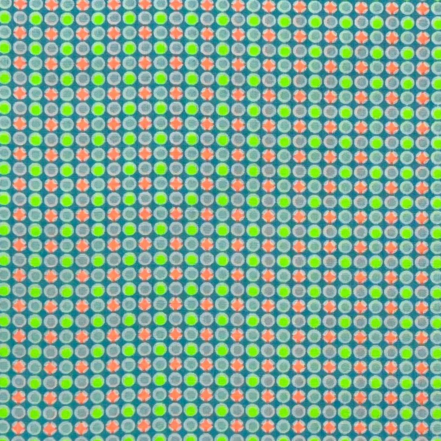 Tessuto fantasia geometrica con pois arancioni e giallo fluo
