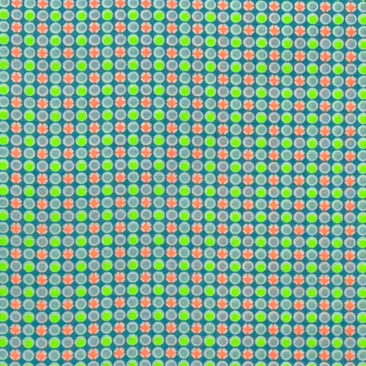 Tessuto fantasia geometrica con pois arancioni e giallo fluo