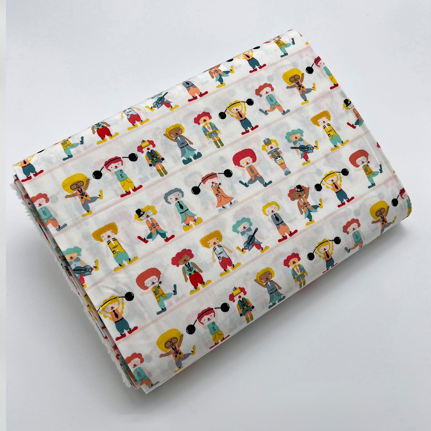 Tessuto fantasia con clown su fondo panna