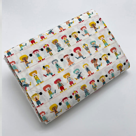 Tessuto fantasia con clown su fondo panna