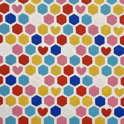 Tessuto a fantasia con esagoni colorati