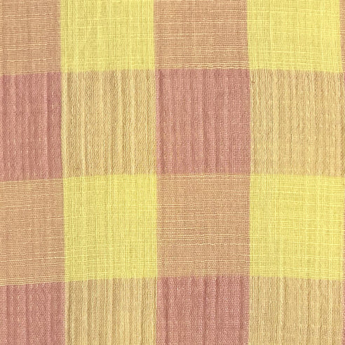 Tessuto in mussola vichy a quadrettoni giallo chiaro e rosa