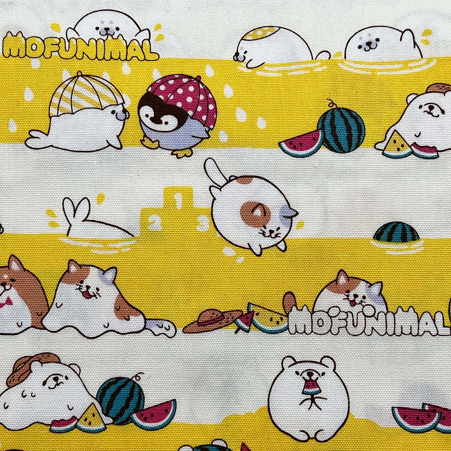 Tessuto fantasia a righe bianche e giallo con animali