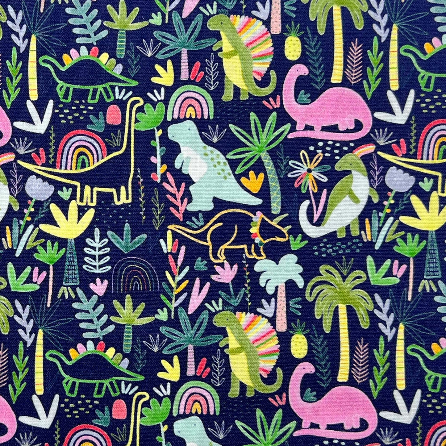 Tessuto a fantasia con dinosauri su fondo blu