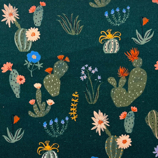Tessuto a fantasia con cactus su fondo verde bottiglia