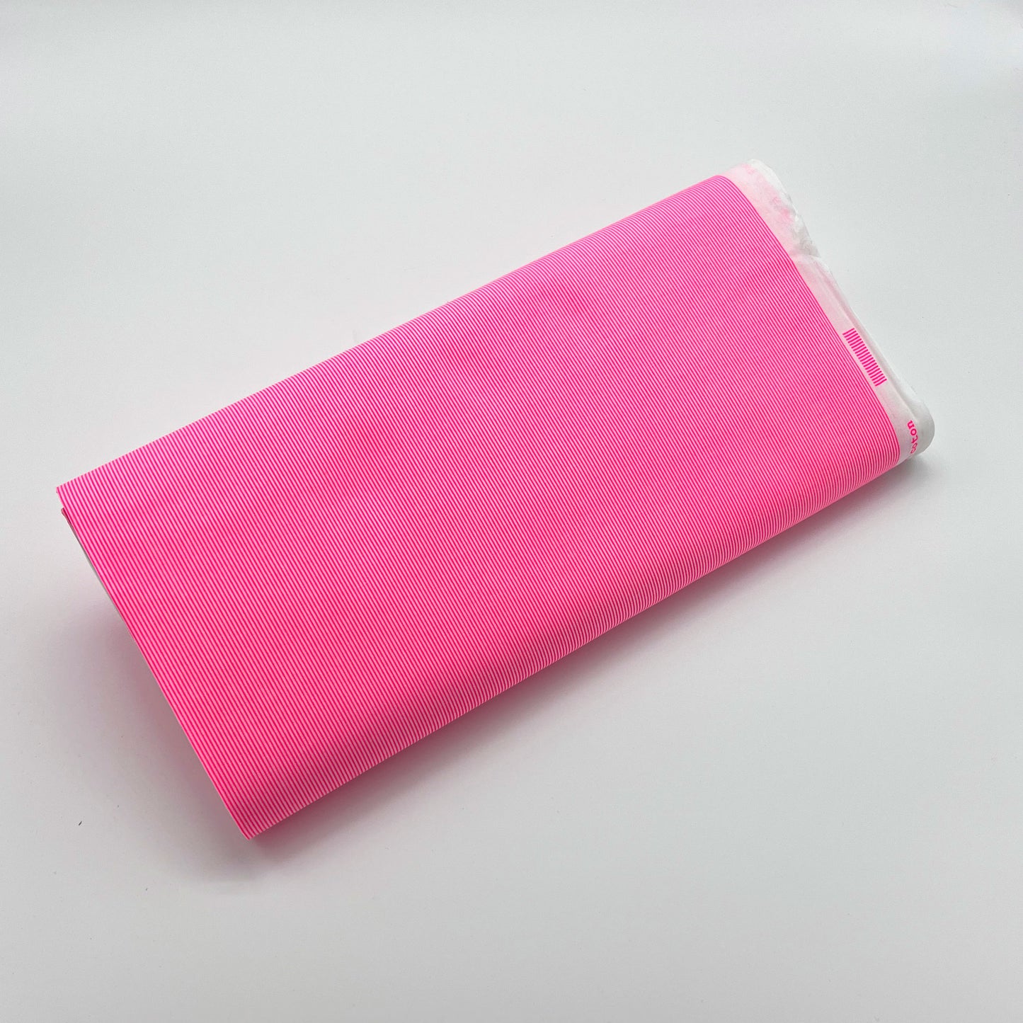 Tessuto millerighe rosa fluo e bianco